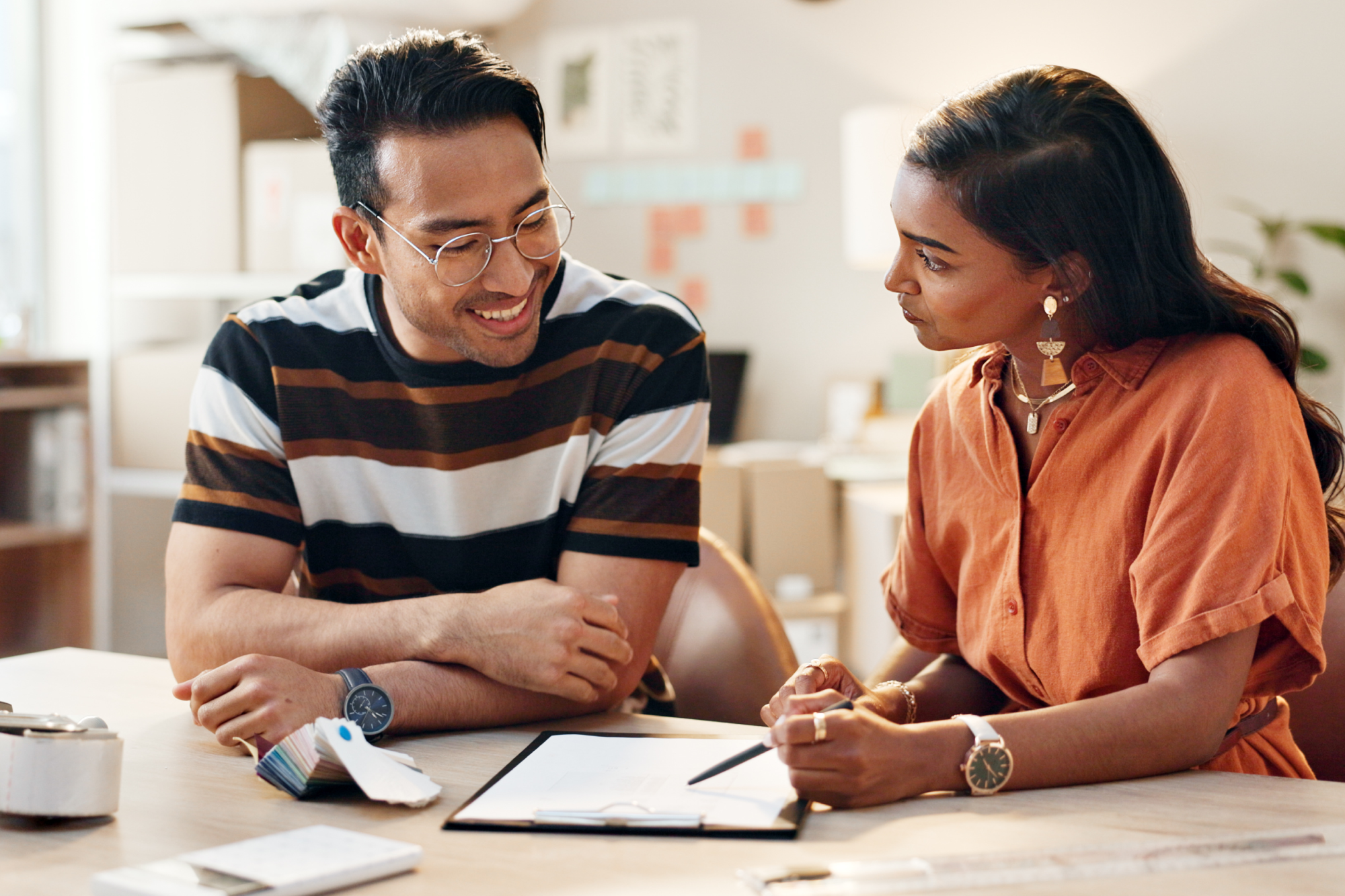 small-business-office-woman-training-employee-with-logistics-checklist-planning-schedule-working-strategy-people-with-inventory-paperwork-learning-hr-rules-workplace